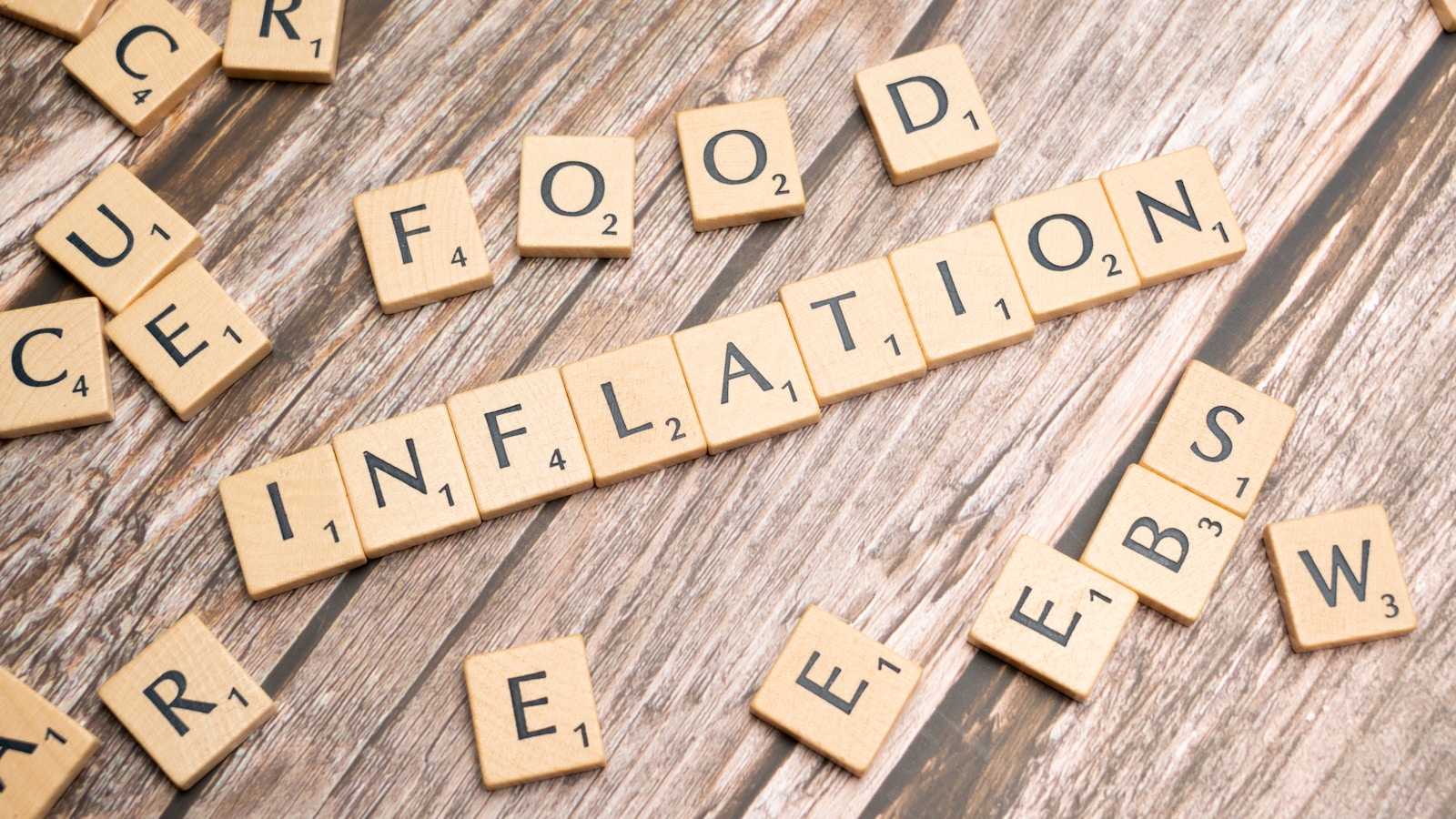 scrabble tiles spelling out food information on a wooden table