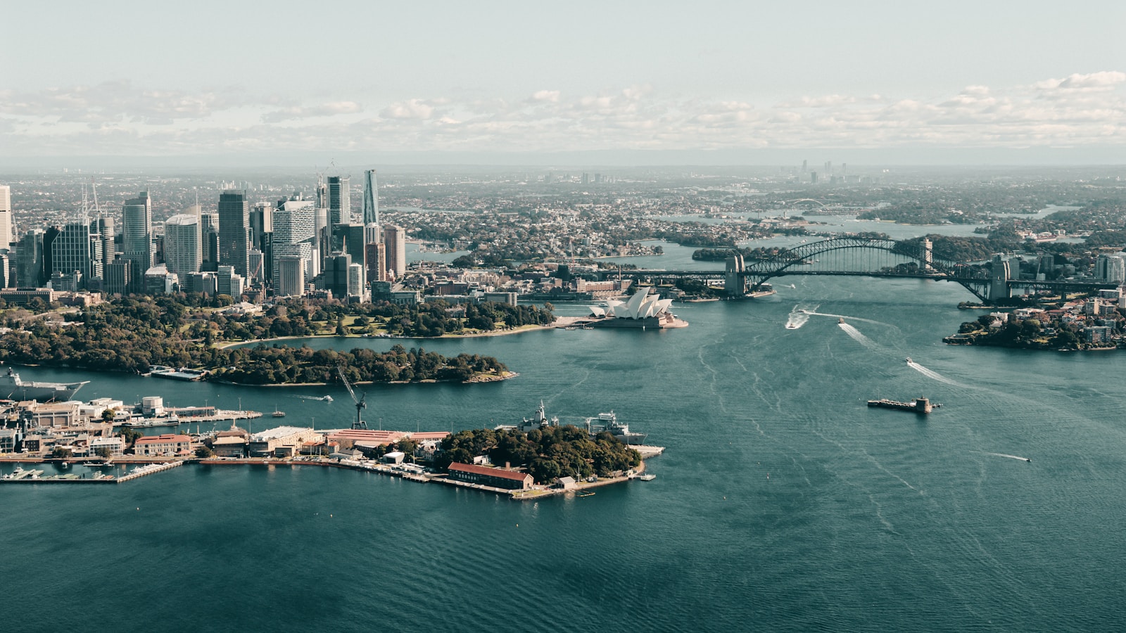 an aerial view of a city and a body of water